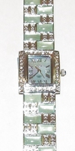 Horloge met groene steentjes en heldere strass 